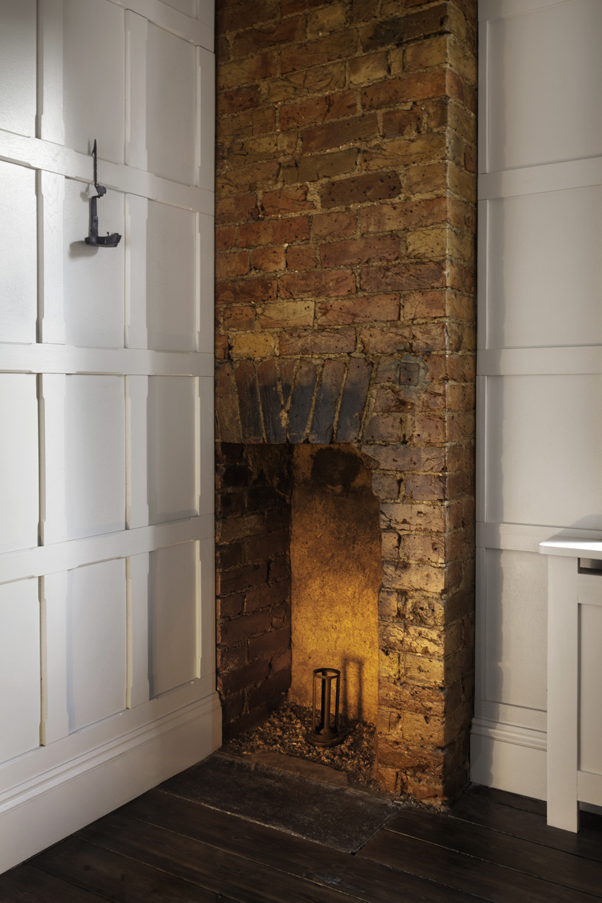 fireplace with exposed brick wall